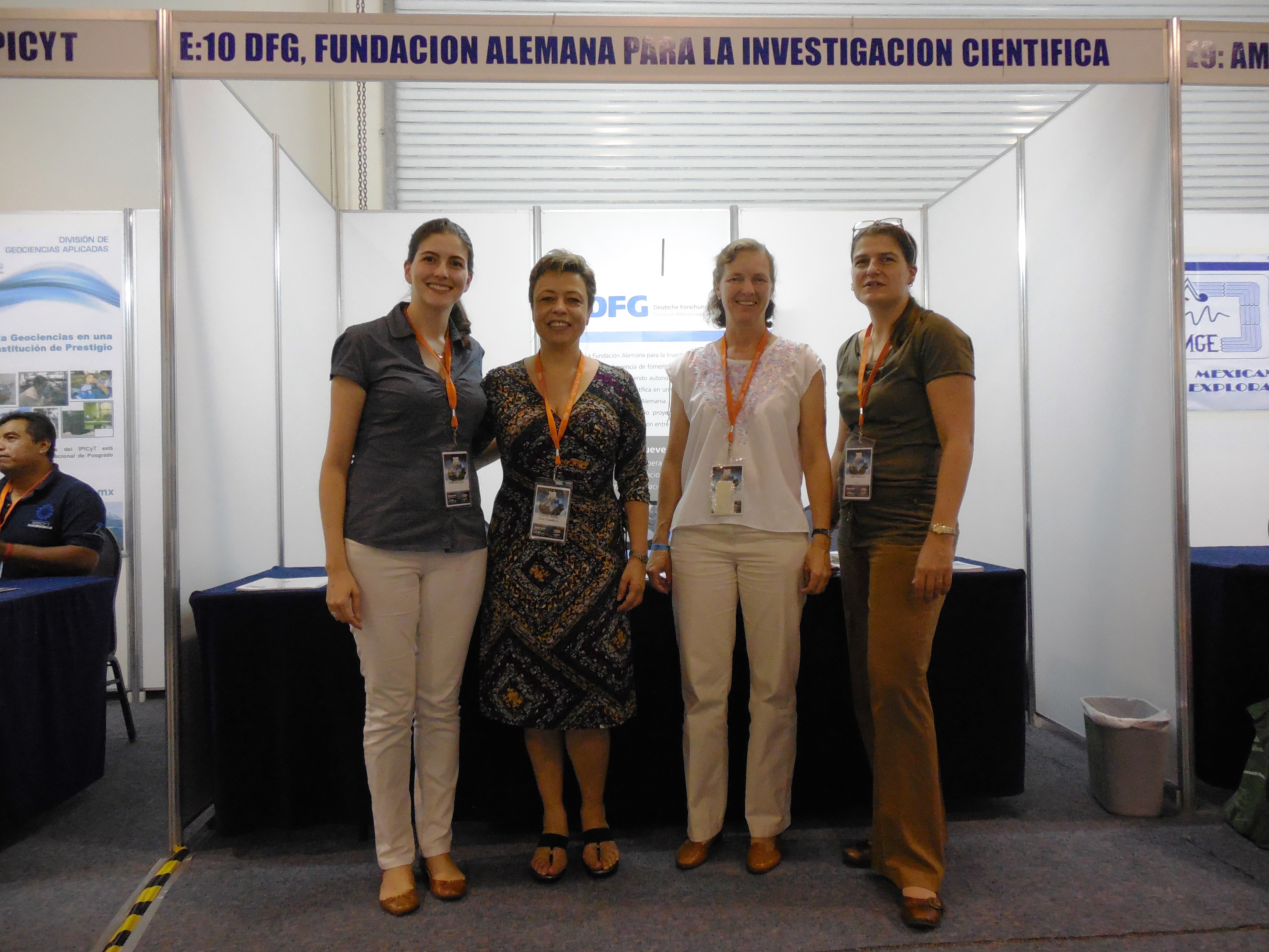 Group photo in front of the DFG stand (from left to right) Laura Redondo (DFG), Prof. Claudia Treviño (Alexander von Humboldt Foundation), Prof. Christina Siebe (DFG) and Susanne Faber (DAAD)