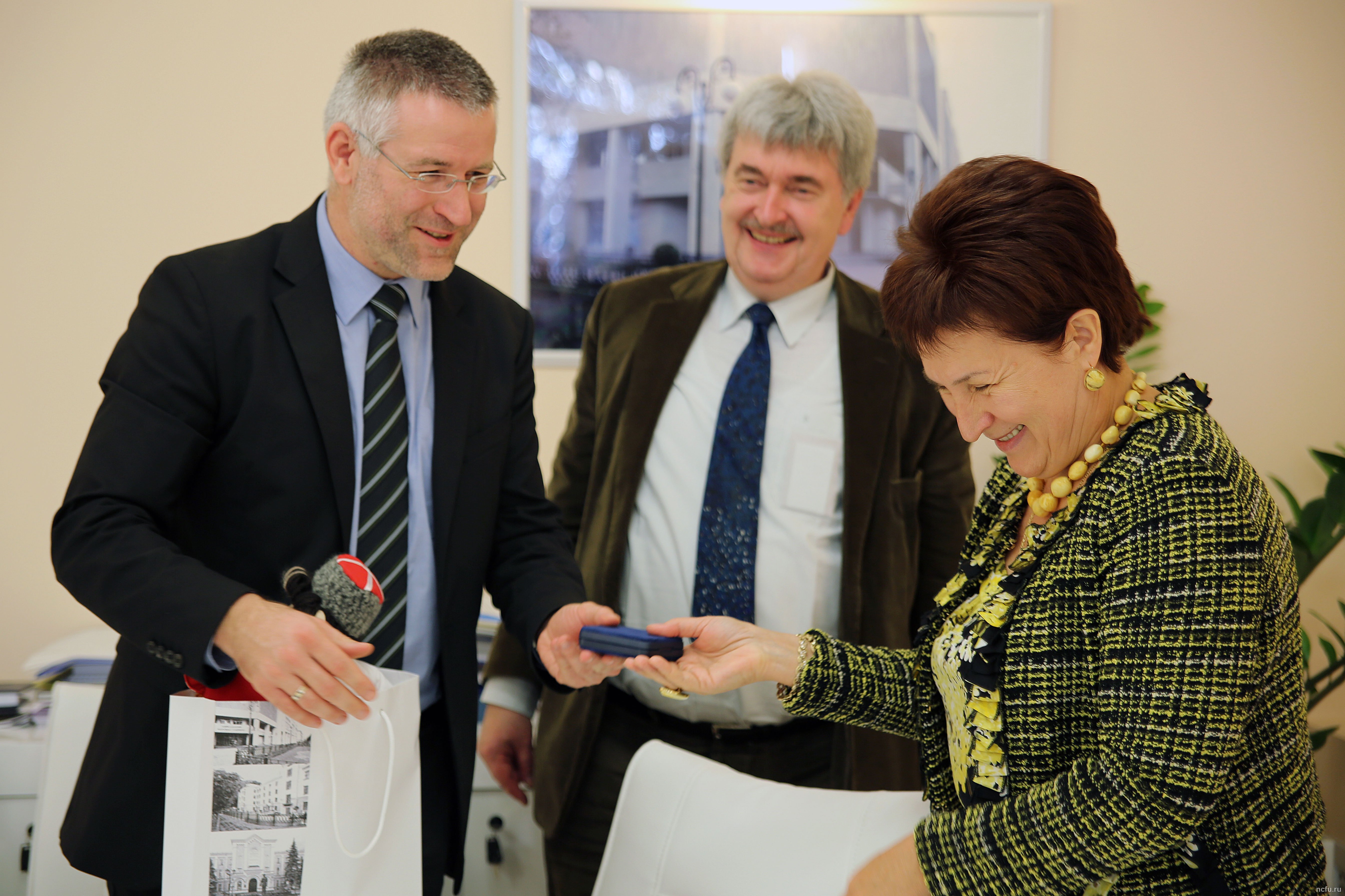 Dr. Jörn Achterberg (DFG Moscow) and Dr. Gregor Berghorn (DAAD Moscow) with Rector Alina Levitskaya (NCFU)