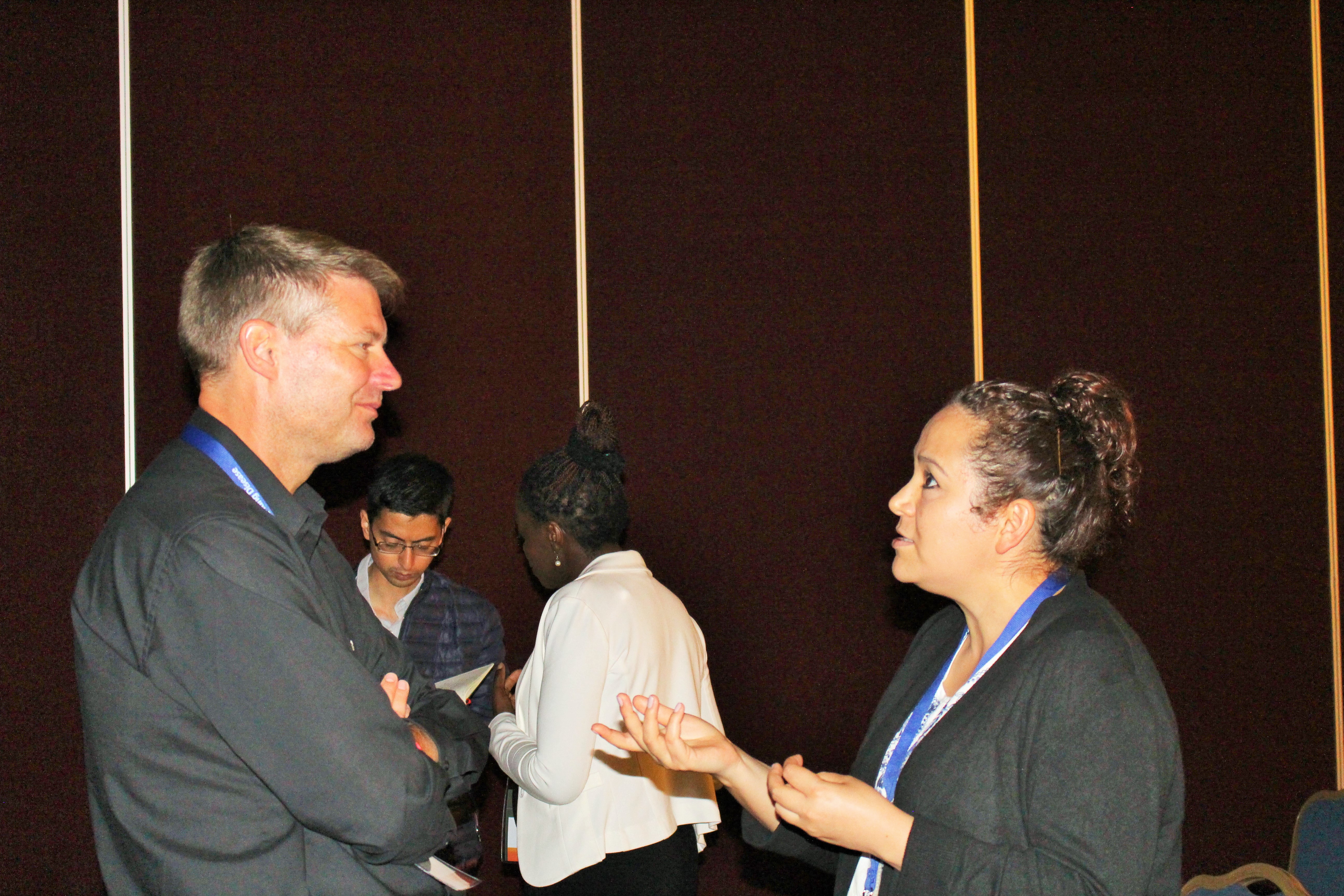 Schnoor (left) talking to Carolina Mijares about doctoral opportunities in Germany
