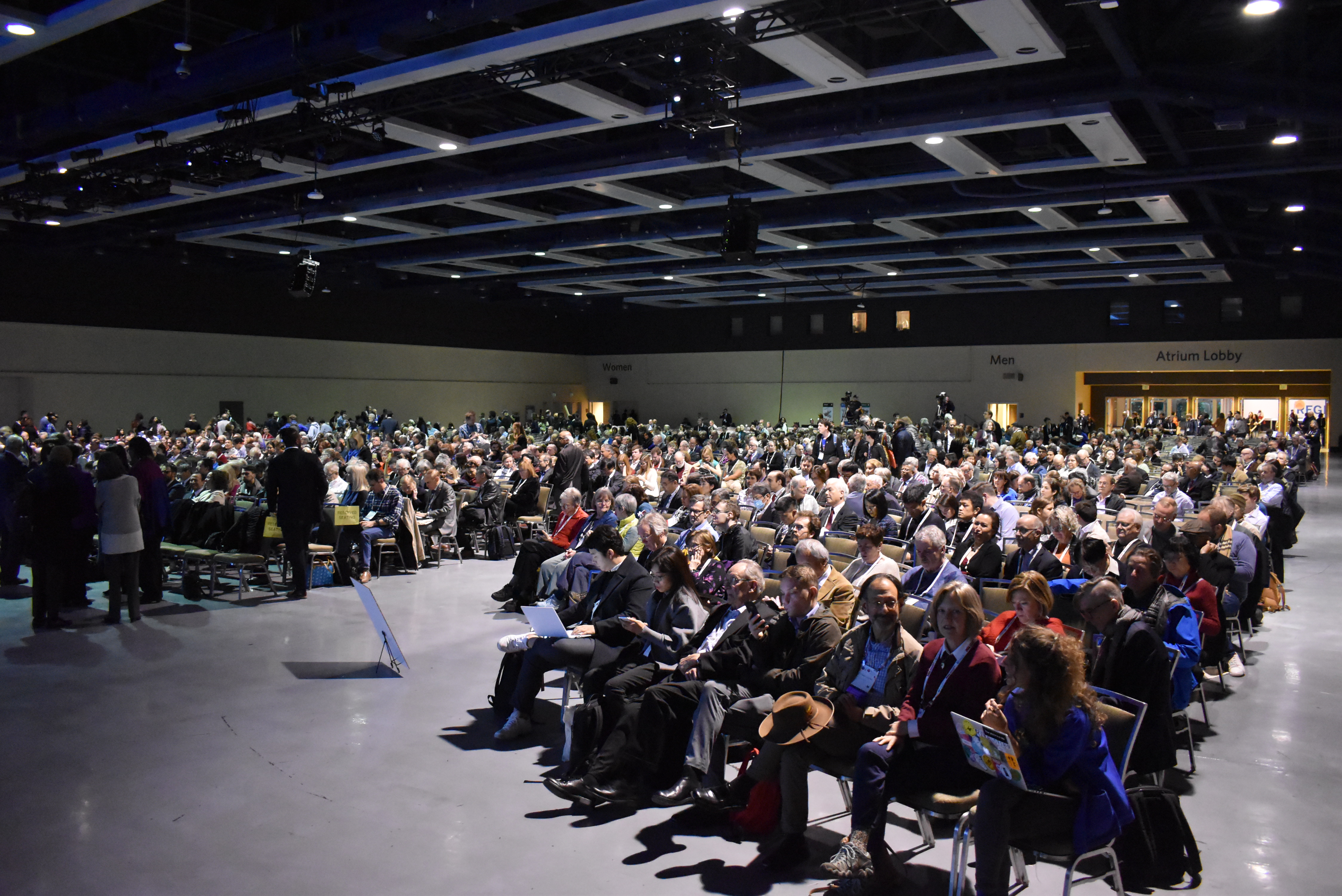 The auditorium waits for Bill Gates