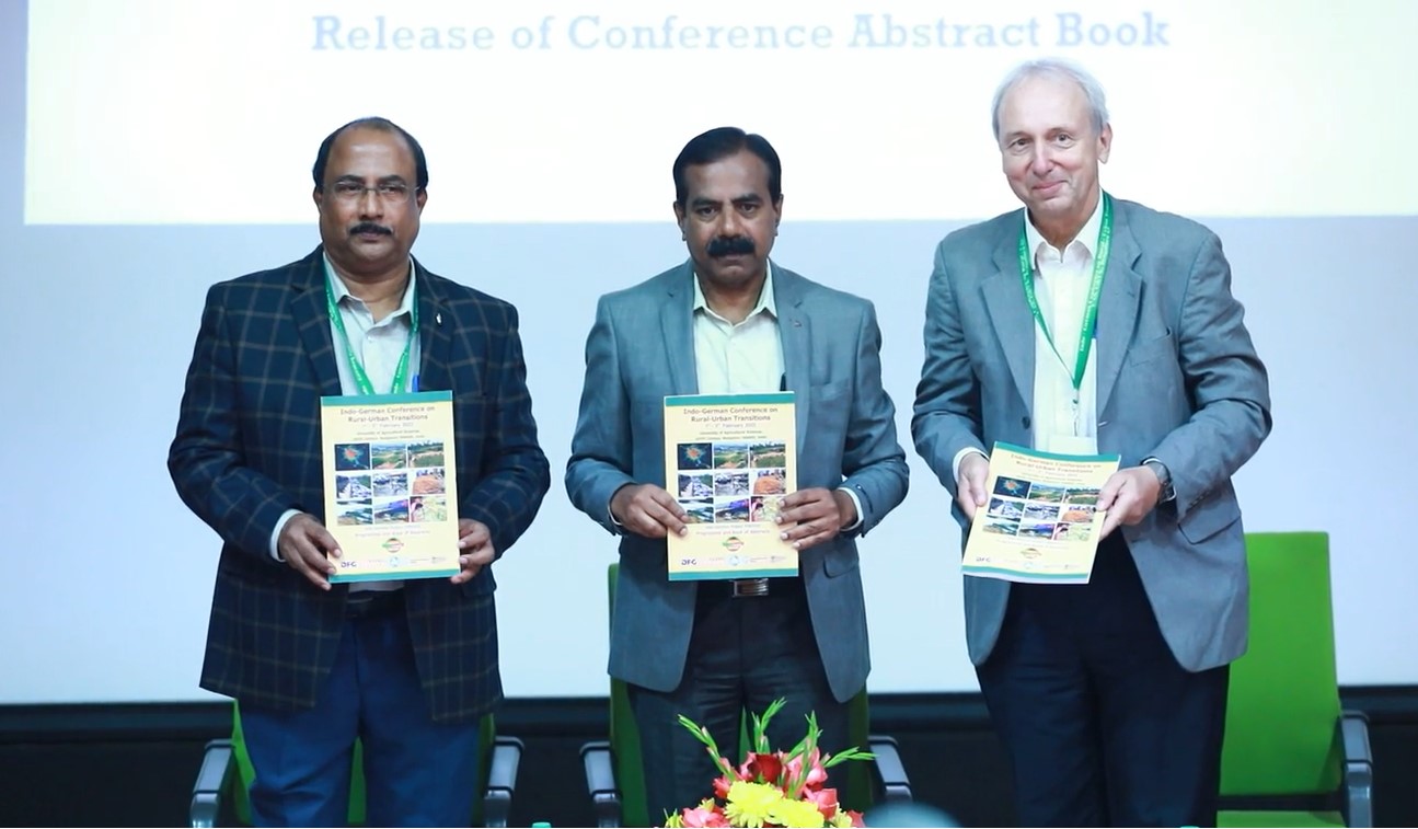 FOR2432 Final Conference 2023 Presentation of the abstract book at the conference opening ceremony. From left to right: Indian spokesperson and coordinator Prof. K.B. Umesh, UASB Vice President Prof. S.V. Suresha, German spokesperson Prof. A. Bürkert.