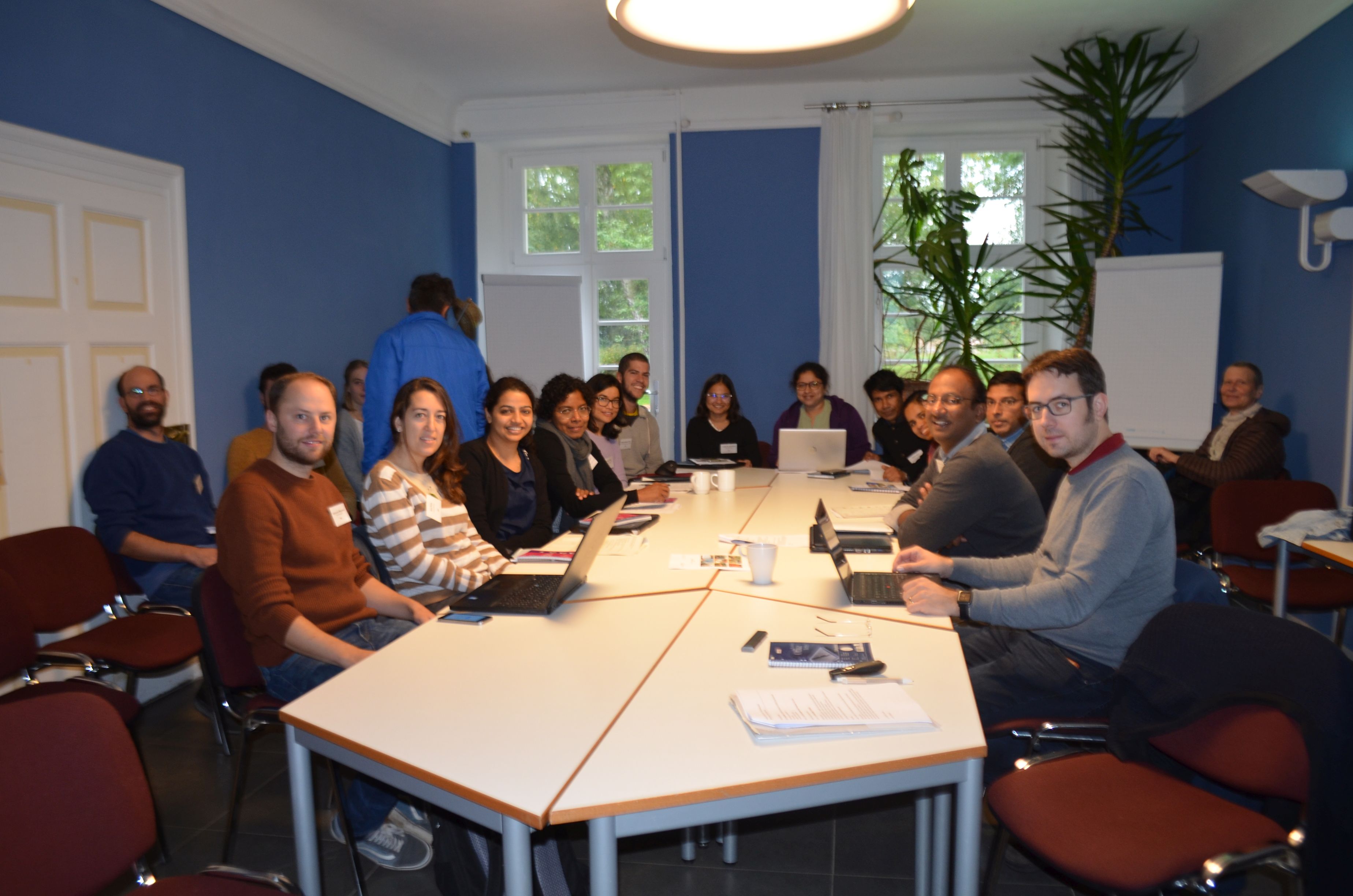 Kick-off seminar for phase II of FOR2432 in Germany, with doctoral students of the first and second cohort. From left to right: (near the wall:) Matthias Spangenberg, Gabriel Marcacci, Verena Preuße (walking:) Albara Almawazreh, (at the table:) Johannes Wegmann, Ana Pinto, Supriya Dayananda, Renuka Suddapuli Hewage, Pramila Thapa, Manuel Santos-Silva, Anjali Purushotham, Sheetal Patil (guest), Shahin Alam, Silpa Mullakkalparambil-Velayudhan, Arvind Laksmisha, Prem J. Vazhacharickal, Prof. Dr. Matthias Gaßmann, (near the wall:) Prof. Dr. Eva Schlecht.