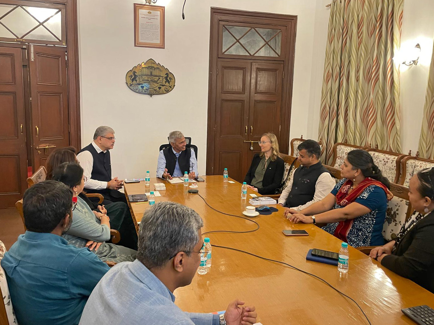 The German delegation engaging with Vice Chancellor Prof. Dr. Suresh Gosavi and the Deans of Savitribai Phule Pune University on Indo-German research cooperation in a conference room.