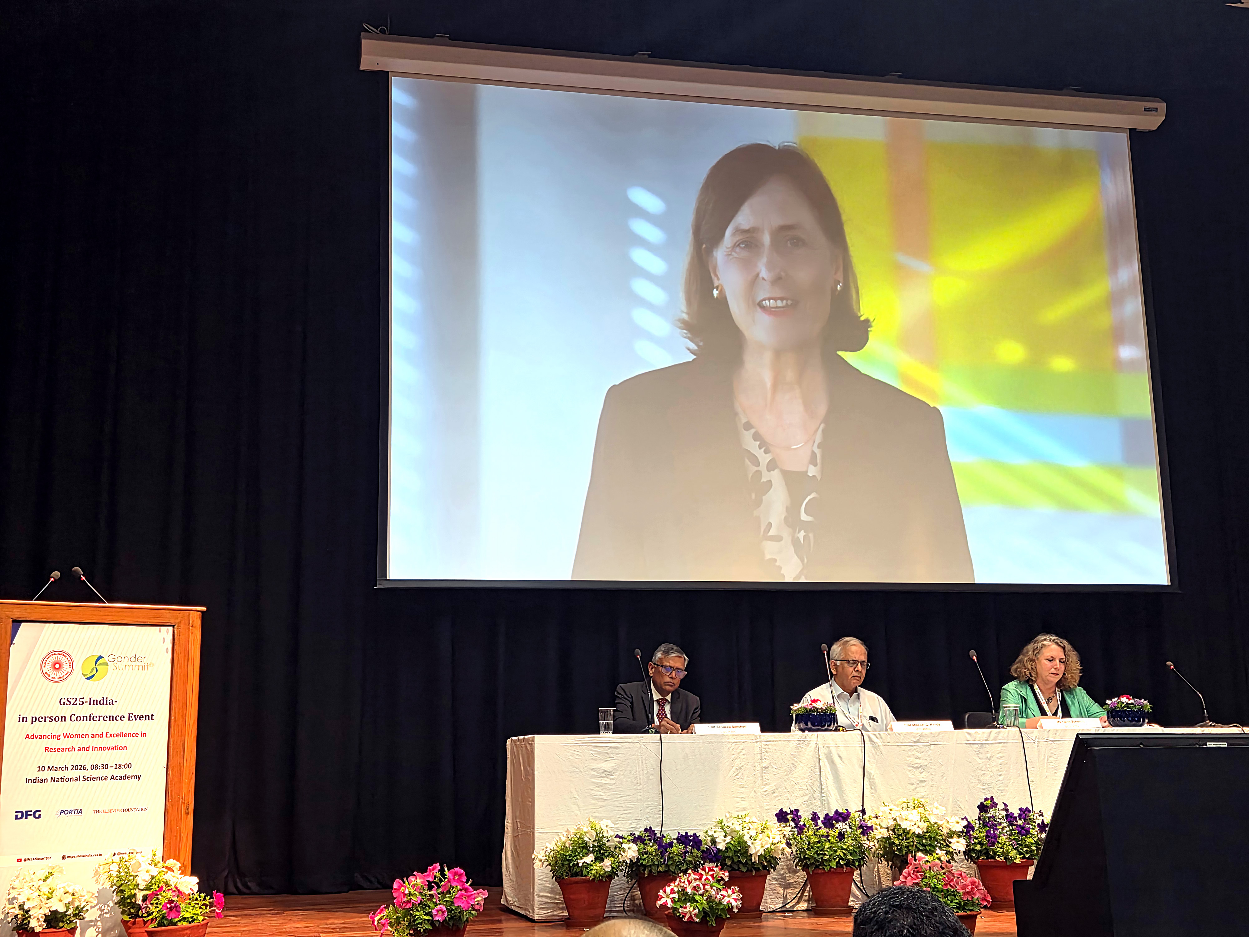 picture at the gender summit with Prof. Katja Becker via video transmission and the following other attendees sitting at a podium: Sandeep Sancheti, Vice President Research Relations and Academic Ambassador for India at Elsevier; Prof. Shekhar Mande, President INSA and Ylann Schemm, Executive Director of the Elsevier Foundation.